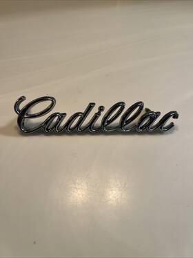 1607891 General Motors 1977-79 Cadillac Deville Fleetwood Header Grille Emblem # Mint