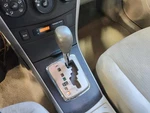 Used Automatic Transmission Shift Lever Assembly Fits: 2010 Toyota Corolla Grad. Fixed Price $80.00.