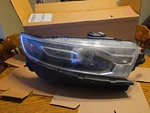 2015 Ford Taurus Right Side Headlight Assembly No Bulbs Slightly Cloudy Lense. Fixed Price $30.00.